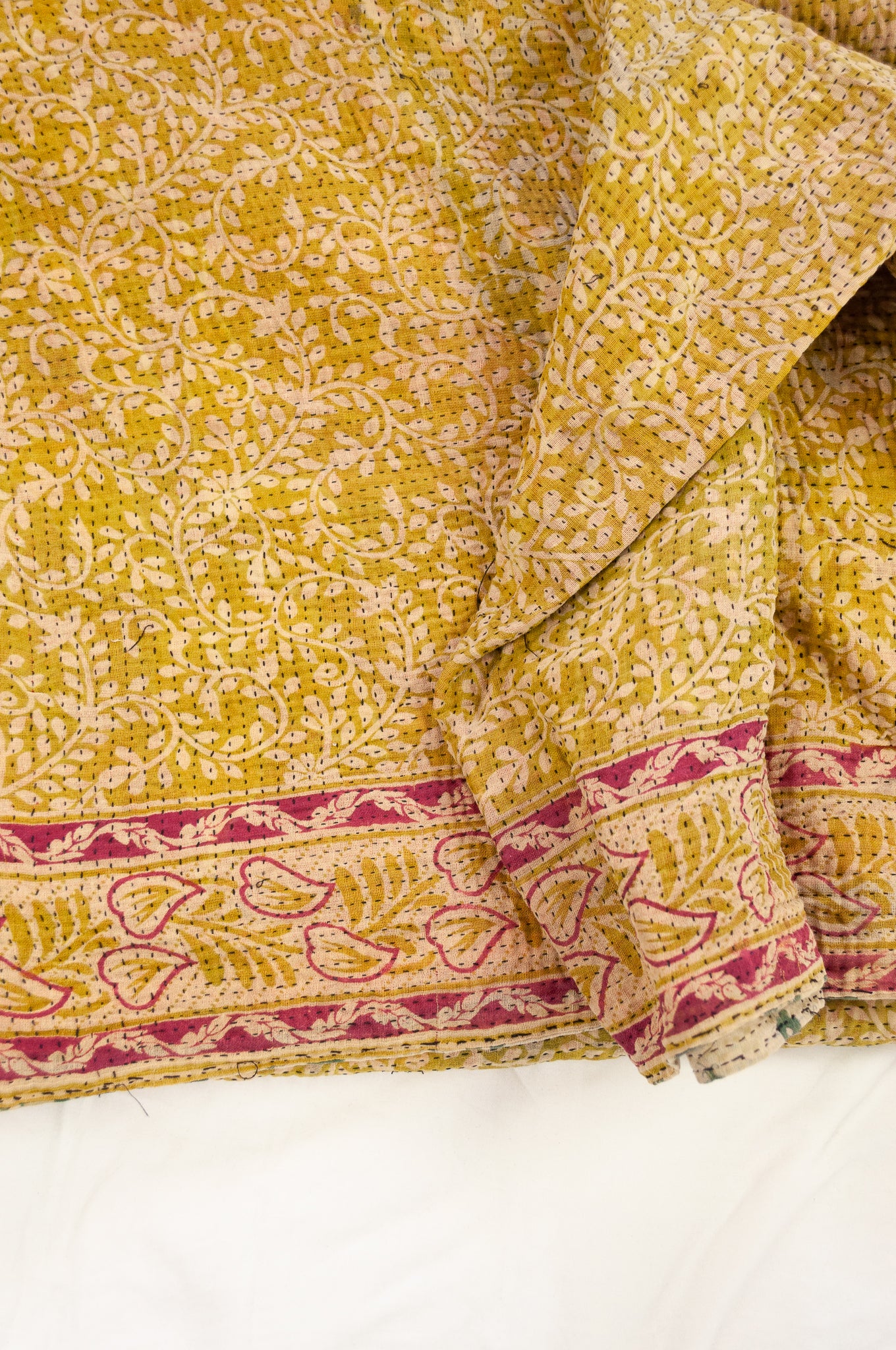 Vintage kantha quilt upcycled from cottonn saris, handstitched, in soft mustard yellow floral with magenta border, green and ecru floral on the reverse.