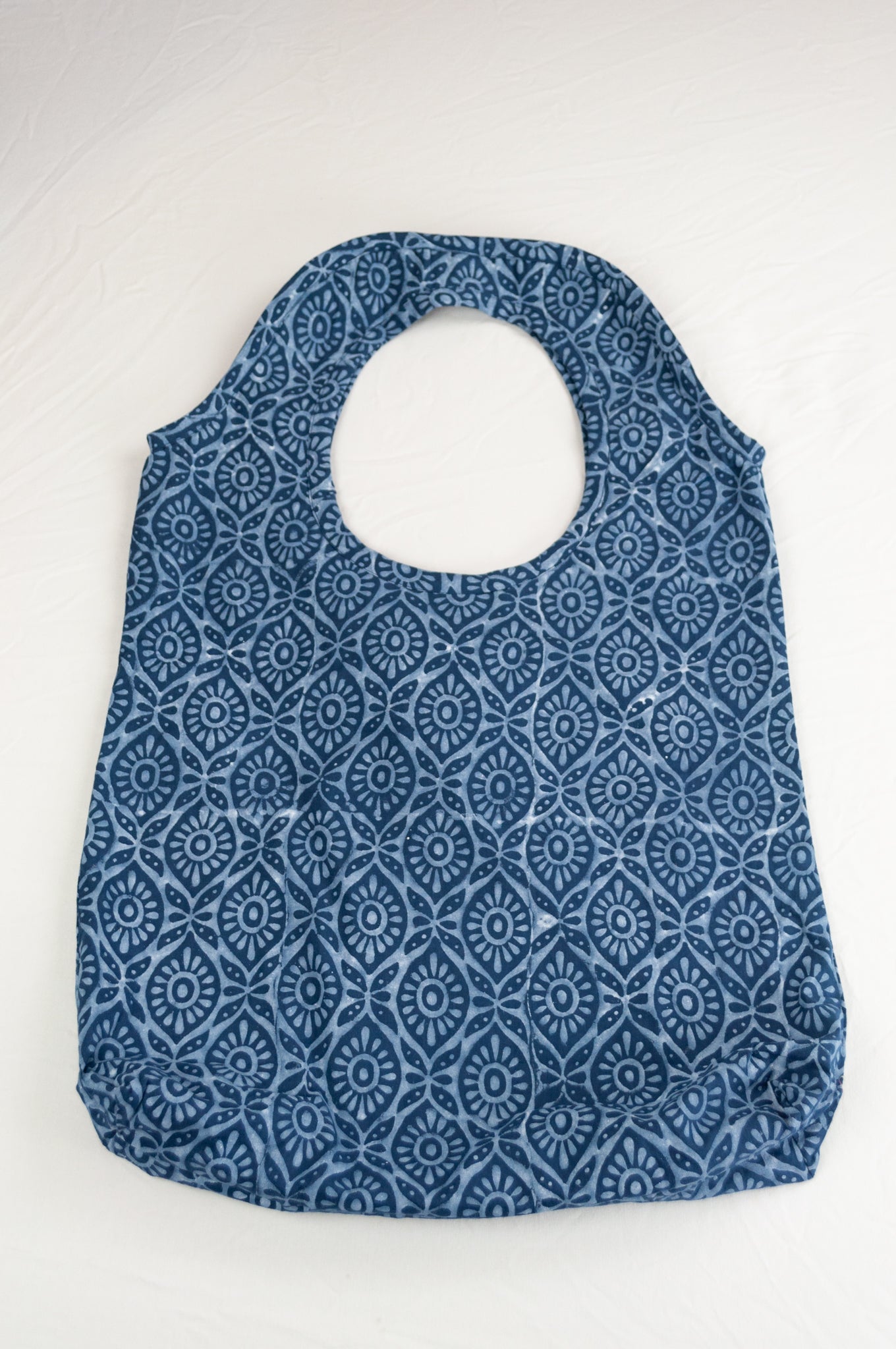Juniper Hearth block print reusable rollable shopping eco bag, indigo graphic floral pattern.