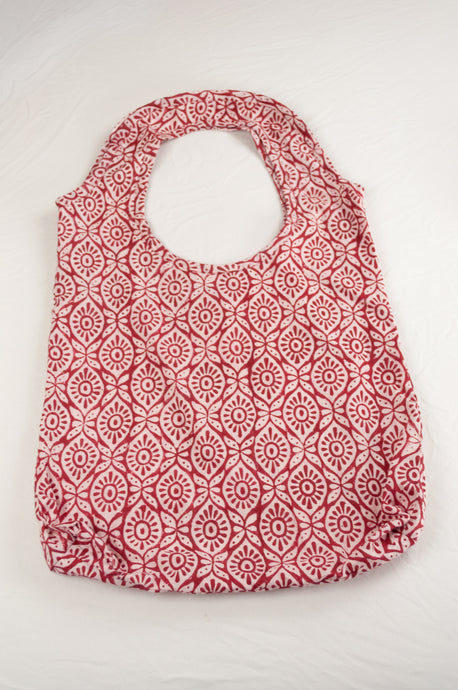 Juniper Hearth block print reusable rollable shopping eco bag, red and white graphic floral pattern.
