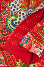 Load image into Gallery viewer, Handstitched cotton kantha quilt, a colourful paisley on a brilliant red background, with highlights in lime, emerald, turquoise, white, and tan