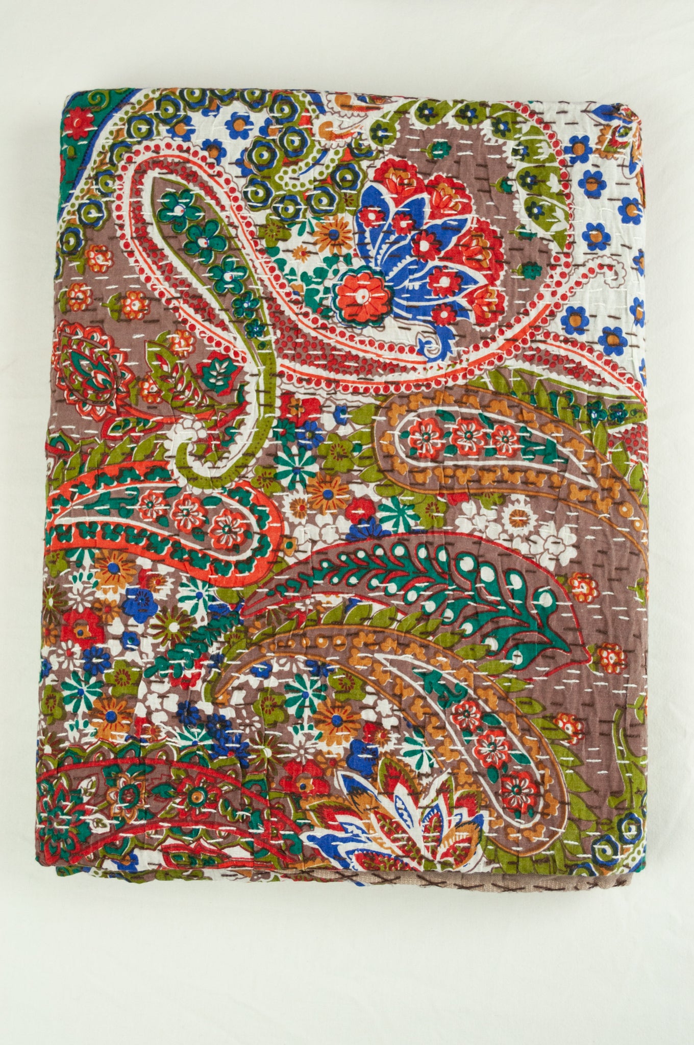 Handstitched cotton Kantha quilt paisley on a chocolate brown background, with highlights in olive green, red, blue, tan and white.