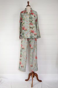 Juniper Hearth cotton voile pyjamas in Country Garden, floral print in rose pink, sage and aqua on soft blue green background. 