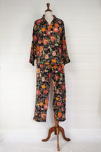 Load image into Gallery viewer, Ethically made cotton voile pyjamas, tropical print of red, gold and orange flowers on black background.
