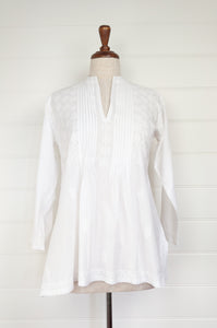 White on white chikankari embroidered pintucked blouse.