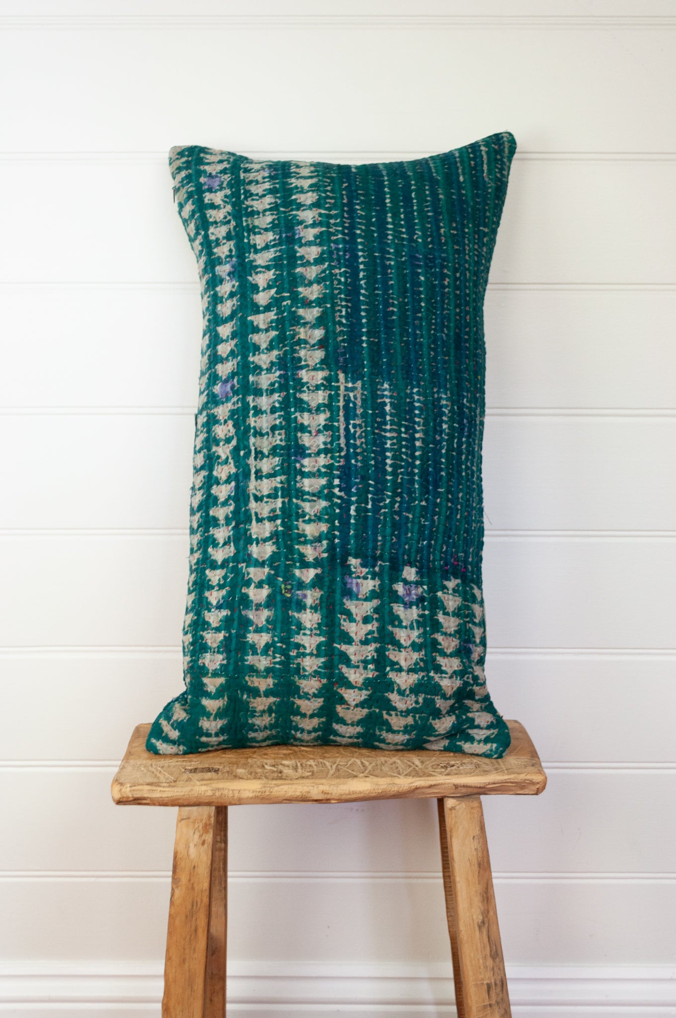 Vintage kantha oblong rectangular bolster cushion blockprinted with arrow and stripe design in deep blue green.