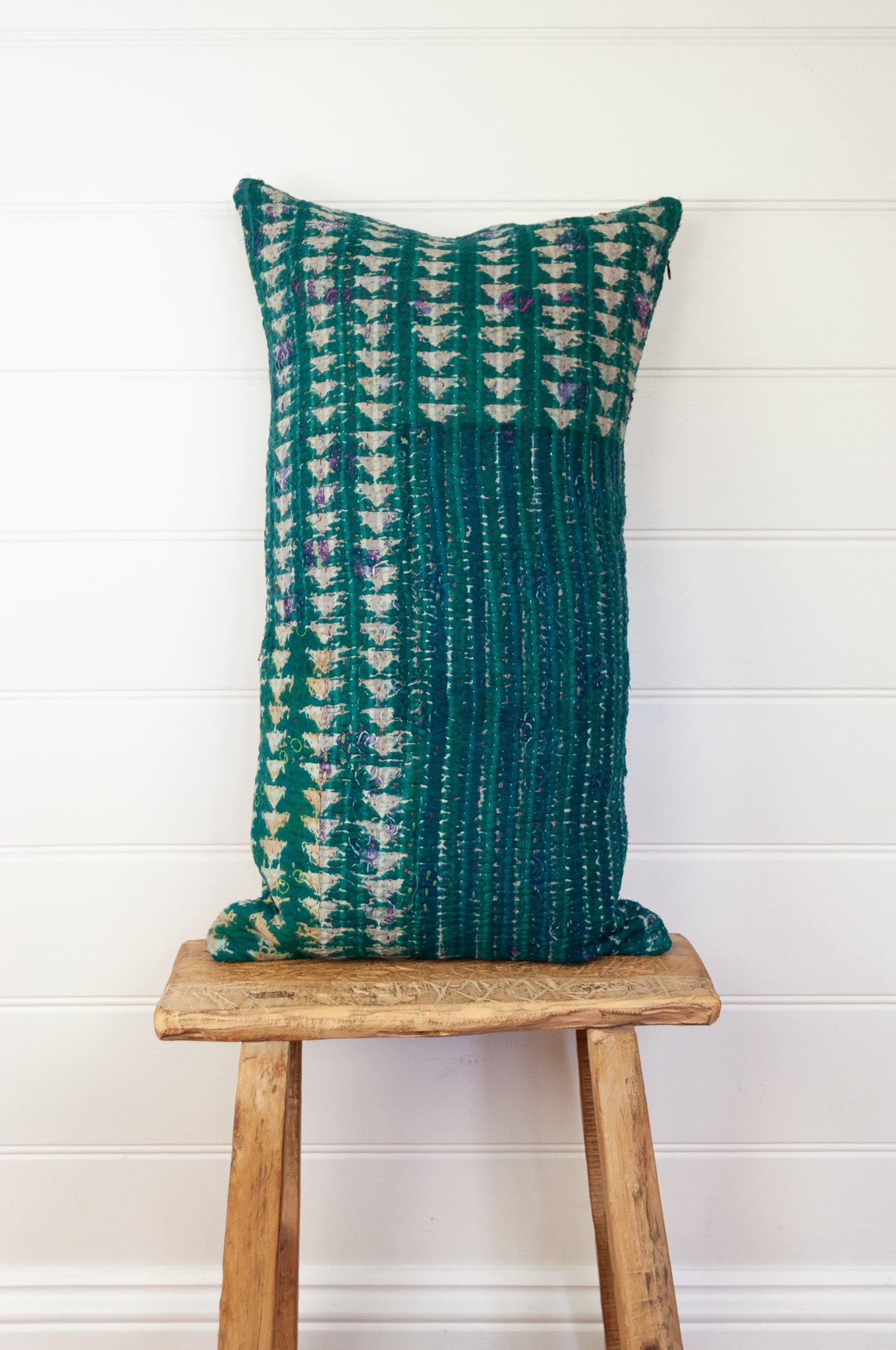 Vintage kantha oblong rectangular bolster cushion blockprinted with arrow and stripe design in deep blue green.