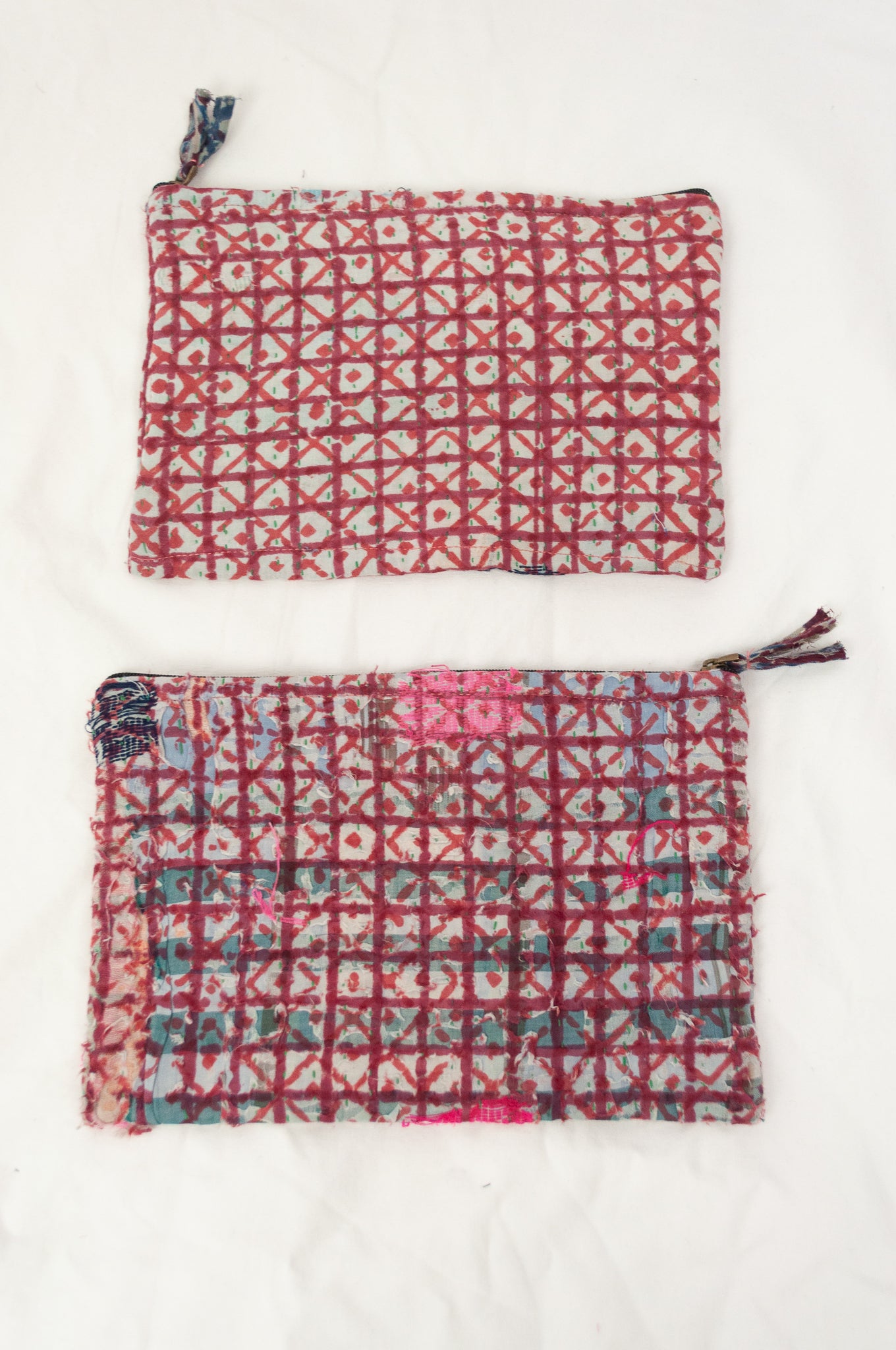Zippered cotton pouches made from vintage kantha quilt remnants in red and white check blockprinted design.