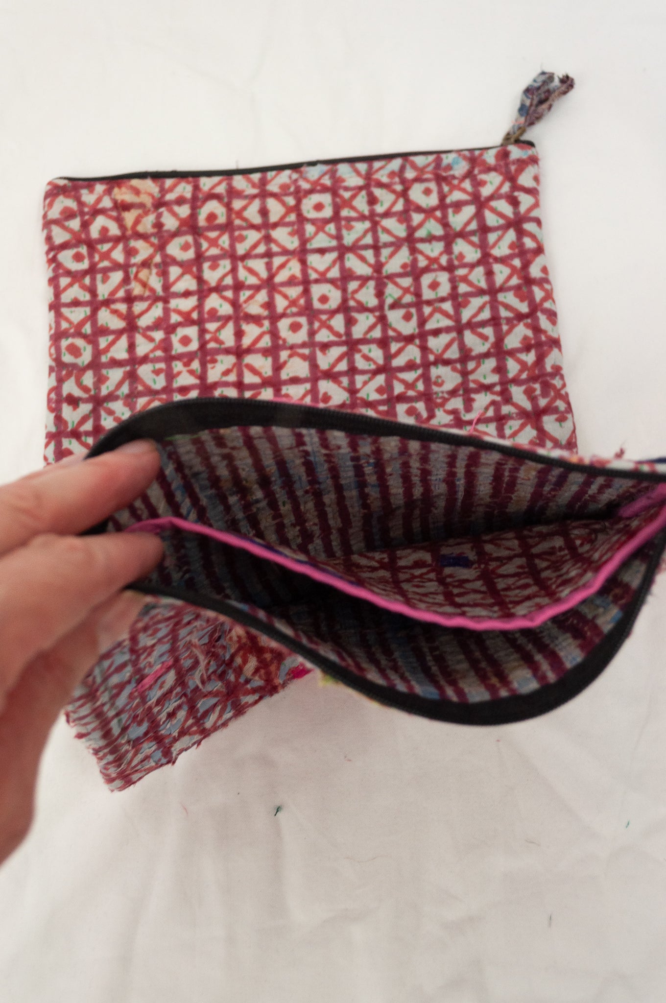 Zippered cotton pouches made from vintage kantha quilt remnants in red and white check blockprinted design.