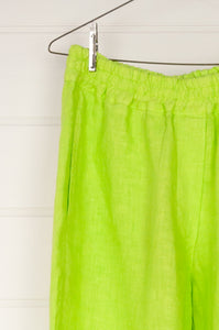 Haris Cotton lime green cropped linen pants with elastic waist, side pockets and rear patch pockets.