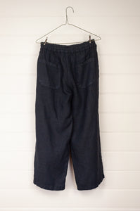 Haris Cotton blue marine navy cropped linen pants with elastic waist, side pockets and rear patch pockets.