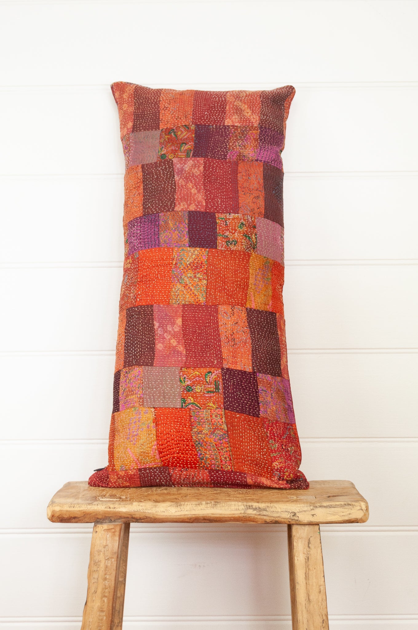 Vintage silk patchwork vibrant shades of russet orange, pink, burgundy.