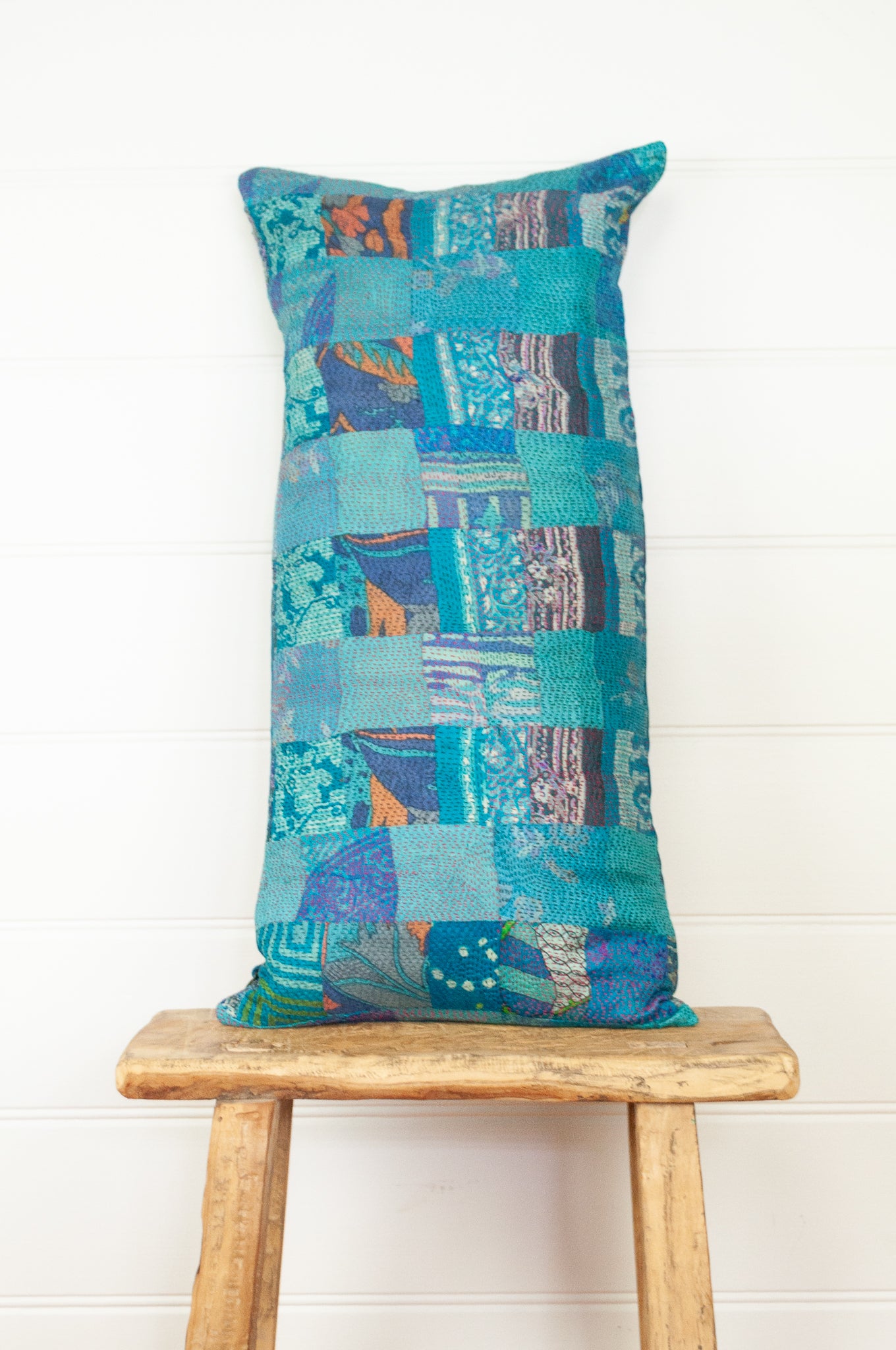 Vintage silk patchwork vibrant shades of cerulean blue with dashes of orange.