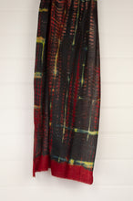 Load image into Gallery viewer, Neeru Kumar fine wool shibori dyed scarf in red black and yellow with highlights of blue.