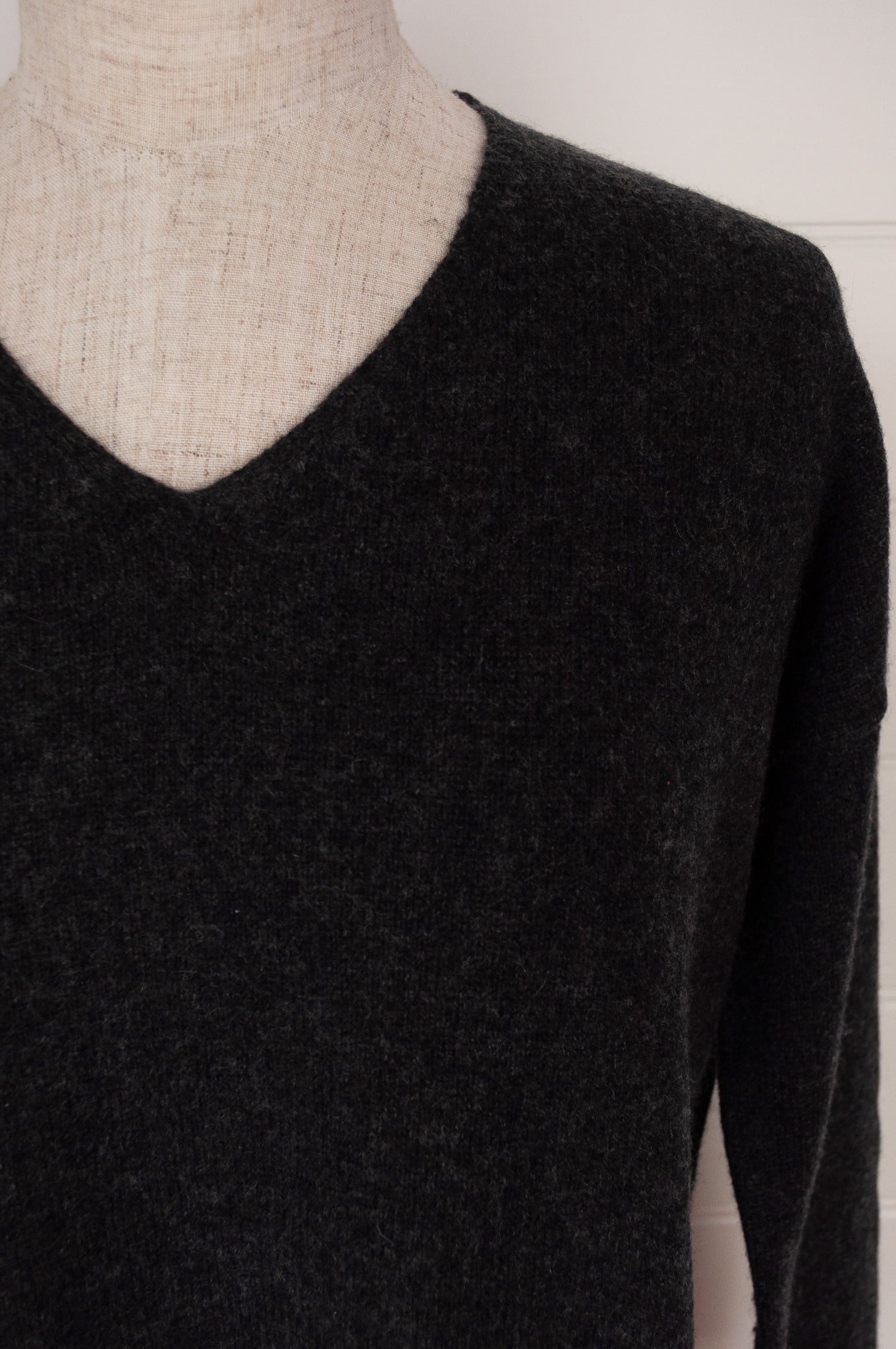 Juniper Hearth classic V neck sweater in pure cashmere, dark charcoal grey, easy fit with side slits.
