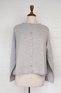 Juniper Hearth ash grey marle reversible one size cashmere cardigan, roll neck edges to neck, sleeves and hem, shell buttons, can be worn as a cardigan or reversed as a sweater.