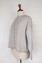 Load image into Gallery viewer, Juniper Hearth ash grey marle reversible one size cashmere cardigan, roll neck edges to neck, sleeves and hem, shell buttons, can be worn as a cardigan or reversed as a sweater.