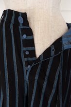 Load image into Gallery viewer, Maku Kosambi pants merino wool striped indigo, wide leg, fitted at waist with pleats, side pockets and button fly.