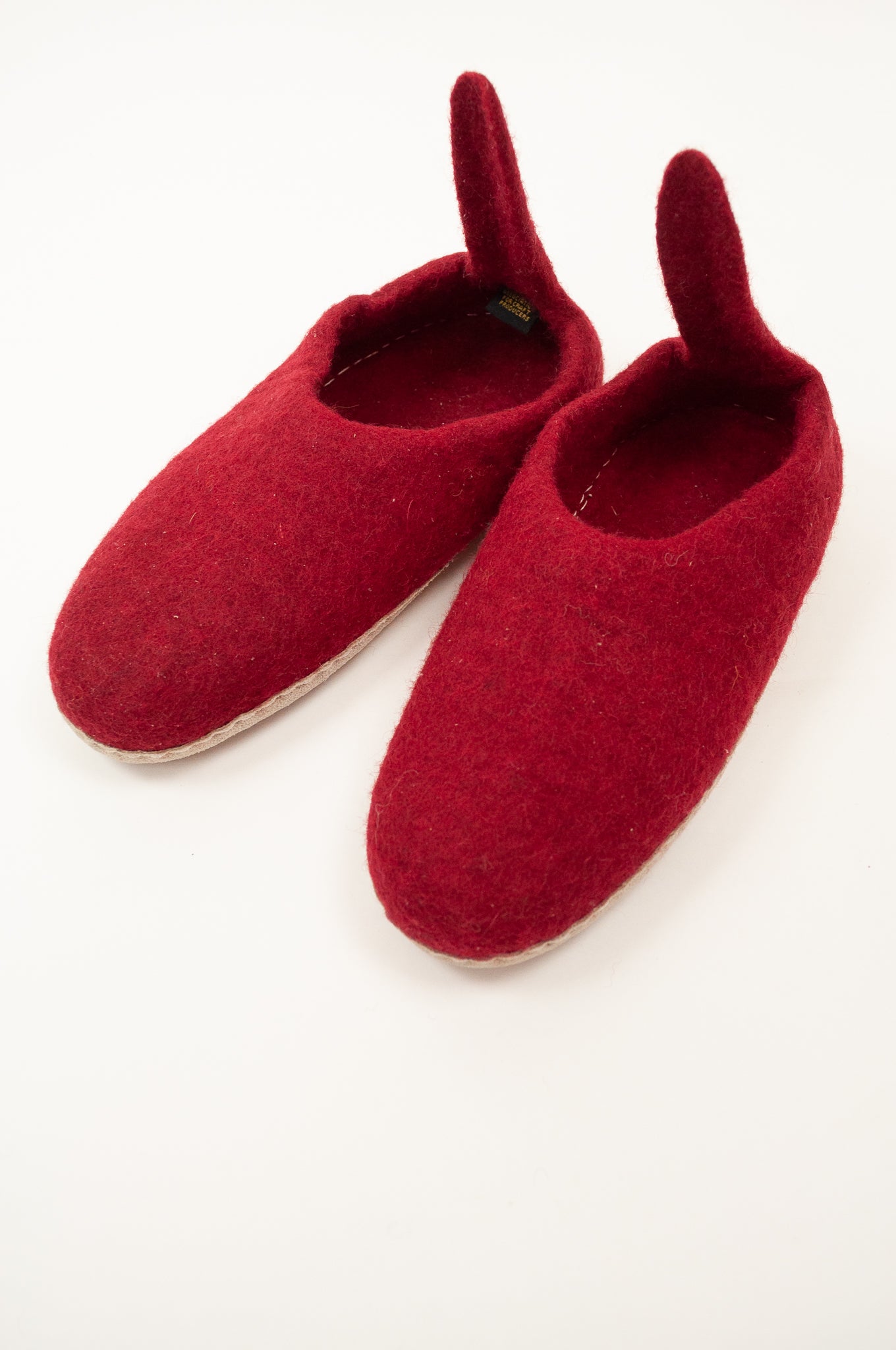 Crimson wool felt slippers with pull on tab, ethically made in Nepal, fair trade.