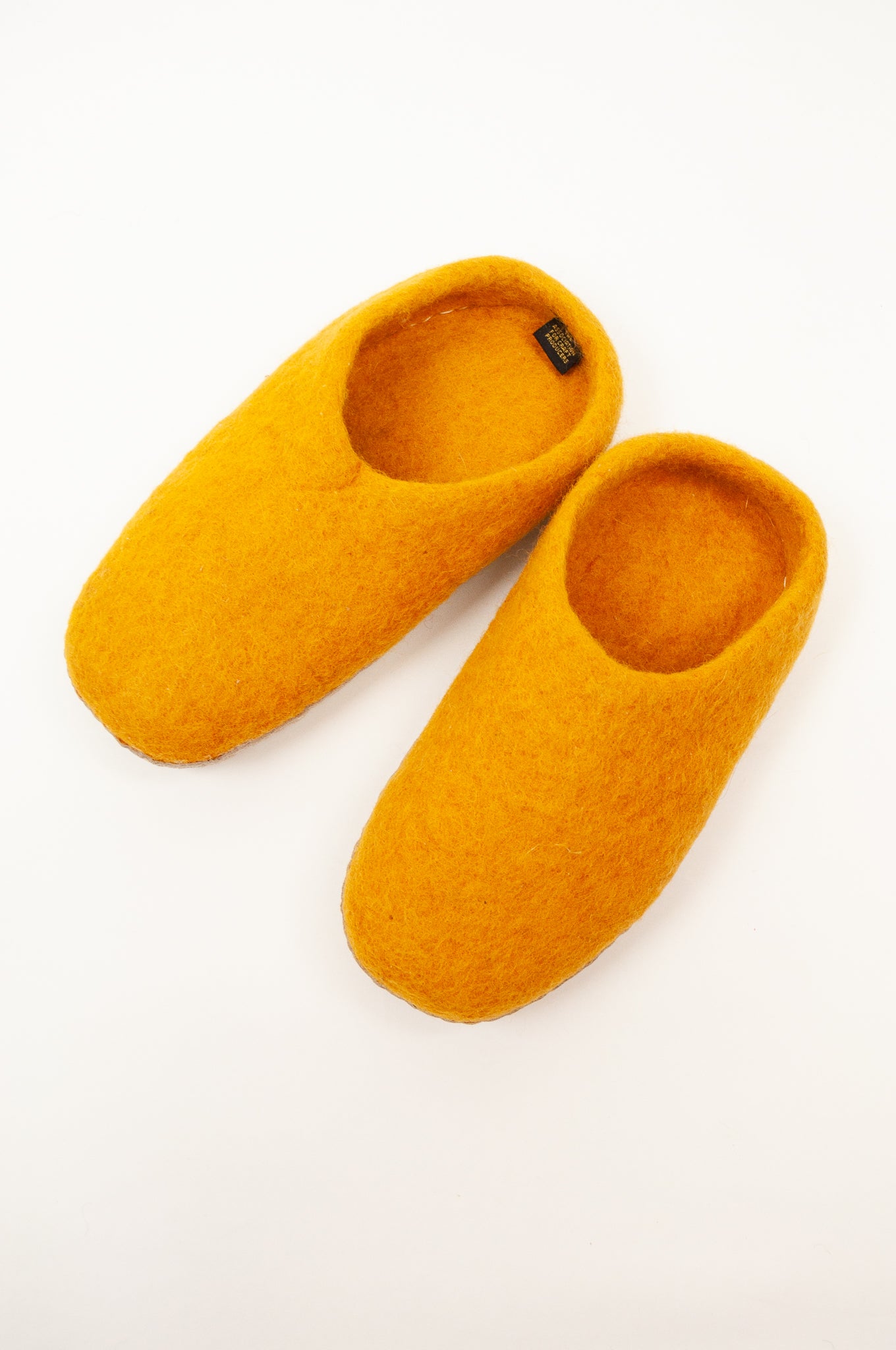 Mustard yellow wool felt slippers, slip on style, fair trade and ethically made in Nepal.