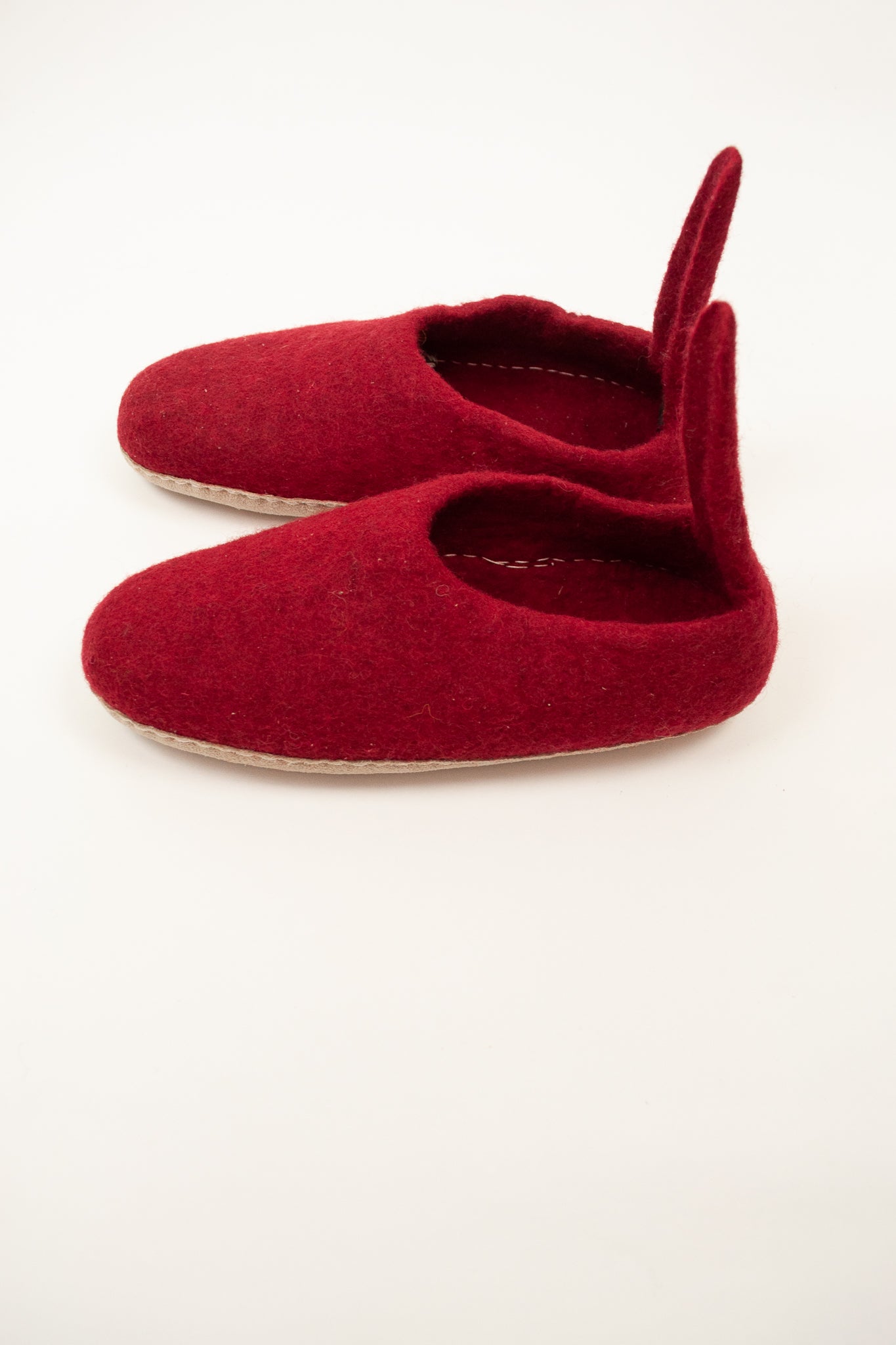Crimson wool felt slippers with pull on tab, ethically made in Nepal, fair trade.