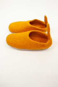 Mustard yellow wool felt slippers, pull on style with tab, fair trade and ethically made in Nepal.