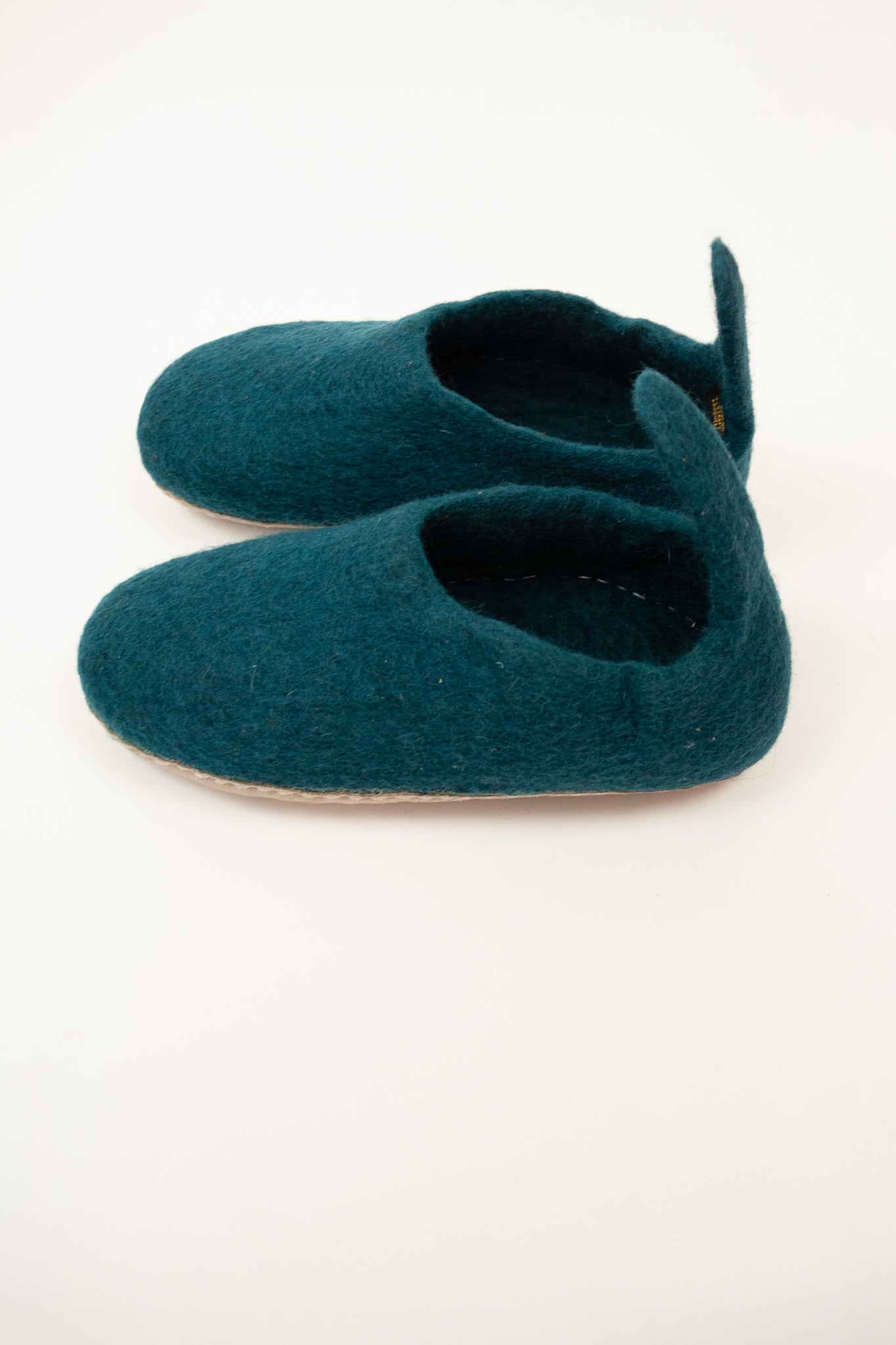 Teal turquoise wool felt slippers, pull on style with tab, fair trade and ethically made in Nepal.