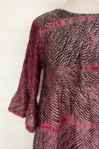 Neeru Kumar silk shibori Alis dress in pink and charcoal, pin tucked bodice and elbow length sleeves.