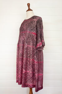 Neeru Kumar silk shibori Alis dress in pink and charcoal, pin tucked bodice and elbow length sleeves.