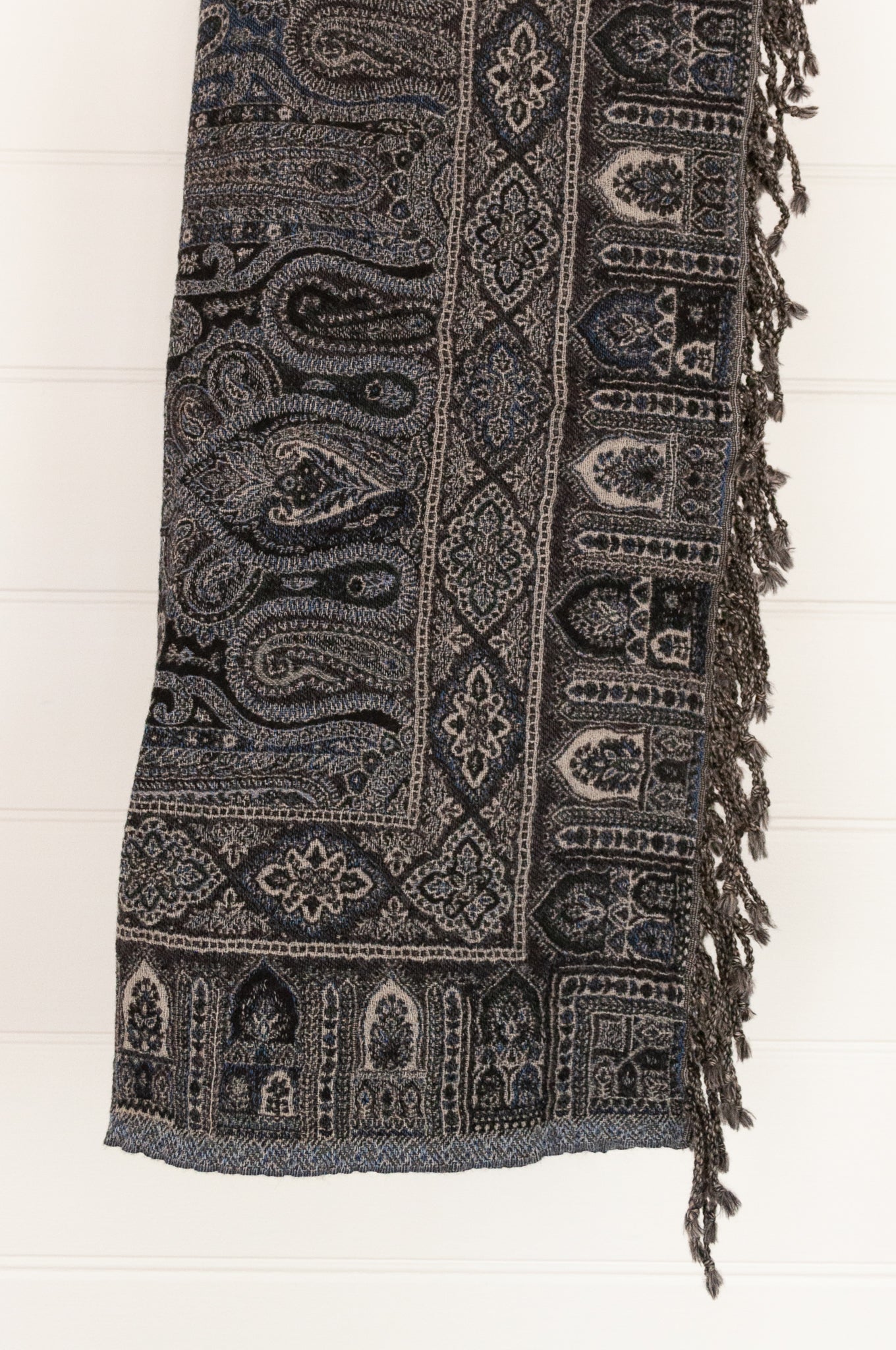 Juniper Hearth pure wool tasseled reversible throw in denim blue, indigo and charcoal grey paisley.