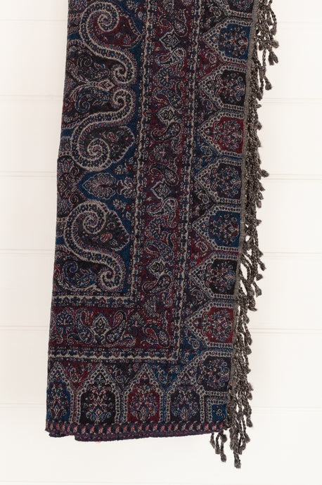 Juniper Hearth pure wool tasseled reversible throw in deep ruby crimson red and sapphire blue.