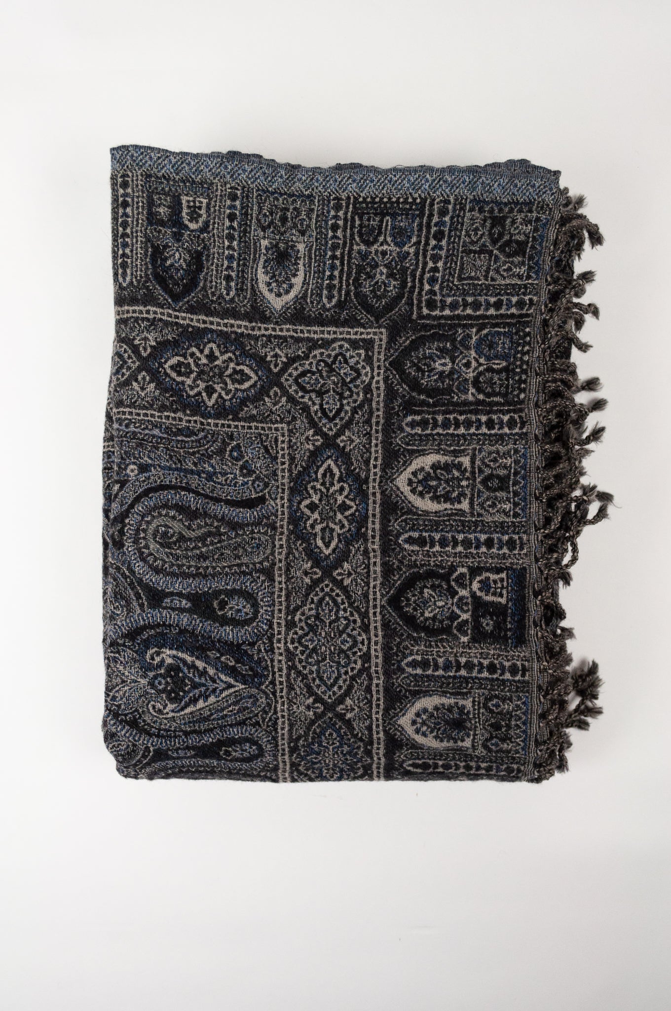 Juniper Hearth pure wool tasseled reversible throw in denim blue, indigo and charcoal grey paisley.