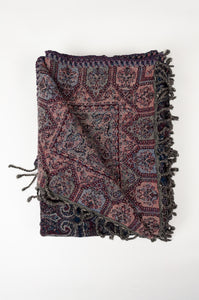Juniper Hearth pure wool tasseled reversible throw in deep ruby crimson red and sapphire blue.