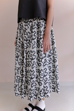 Load image into Gallery viewer, Runaway Bicycle Gina skirt, white handloom silk with black abstract floral blockprint.