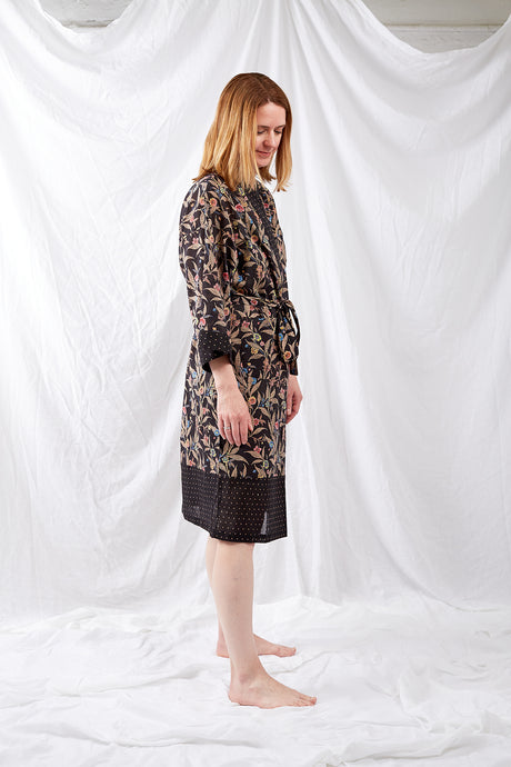 Ethically made, cotton voile kimono robe dressing gown in floral print on black.