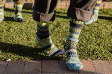 Load image into Gallery viewer, Solmate recycled cotton mismatched Lemongrass socks in dark gray, lime green, navy blue, and cobalt teal.
