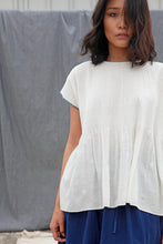 Load image into Gallery viewer, DVE Collection Adya one size top in white jamdani cotton, pin tucking at front, smock panel at back, loose fitting with cap sleeves and selvedge detailing to sides in blue.
