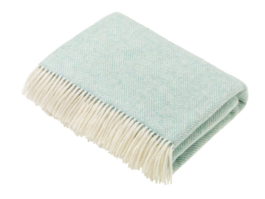 Bronte by Moon Herringbone throw in eucalyptus soft blue green merino wool. Made in England.
