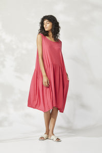 Valia Marissa dress in cotton knit, raspberry red. Sleeveless with round neck and dropped circle skirt, side pockets.