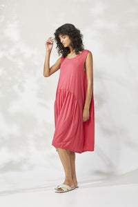 Valia Marissa dress in cotton knit, raspberry red. Sleeveless with round neck and dropped circle skirt, side pockets.