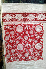 Load image into Gallery viewer, Ethically made artisan block print pure cotton napkin set, crimson red on white floral design with border. Showing the sampling process.