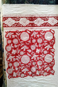 Ethically made artisan block print pure cotton napkin set, crimson red on white floral design with border. Showing the sampling process.